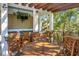 Outdoor bar area with wooden tables, chairs, and a pergola at 4252 Faber Place Dr # 203, North Charleston, SC 29405
