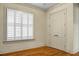 Empty bedroom with hardwood floors, window with shutters and double doors at 4252 Faber Place Dr # 203, North Charleston, SC 29405
