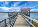 Wooden dock with gazebo, offering scenic water views at 4252 Faber Place Dr # 203, North Charleston, SC 29405