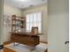 Home office featuring a large desk, built-in shelving, and hardwood floors at 4252 Faber Place Dr # 203, North Charleston, SC 29405