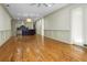 Open living room with hardwood floors and kitchen view at 4252 Faber Place Dr # 203, North Charleston, SC 29405