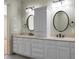 Double vanity bathroom with large mirrors at 4252 Faber Place Dr # 203, North Charleston, SC 29405
