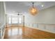 Spacious living room featuring hardwood floors and a large chandelier at 4252 Faber Place Dr # 203, North Charleston, SC 29405
