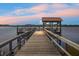 Wooden dock and gazebo at sunset, peaceful water views at 4252 Faber Place Dr # 203, North Charleston, SC 29405