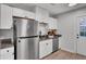 Kitchen with stainless steel appliances and white cabinets at 2748 E Surrey Dr, North Charleston, SC 29405