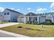 Newly built home with a gray exterior and two-car garage at 407 Hampstead Ct, Summerville, SC 29486