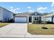 Newly built home with a gray exterior and two-car garage at 407 Hampstead Ct, Summerville, SC 29486