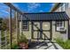 Charming backyard storage shed with painted wood siding and metal roof at 202 Mary St, Edisto Island, SC 29438