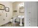 Accessible bathroom with pedestal sink, grab bars, and large walk-in shower at 202 Mary St, Edisto Island, SC 29438