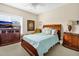 Guest bedroom with queen-size bed and wood furniture at 202 Mary St, Edisto Island, SC 29438