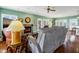 Relaxing living room with fireplace and access to deck and kitchen at 202 Mary St, Edisto Island, SC 29438