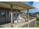 Spacious deck with white adirondack chairs, offering relaxing outdoor space at 202 Mary St, Edisto Island, SC 29438