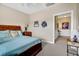 Guest bedroom with queen-size bed and access to hallway at 202 Mary St, Edisto Island, SC 29438