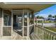 Relaxing screened porch with outdoor seating and views of the neighborhood at 202 Mary St, Edisto Island, SC 29438