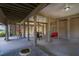 Spacious covered patio area with swings and seating at 202 Mary St, Edisto Island, SC 29438