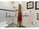 Walk-in shower with grab bars and built-in seat at 202 Mary St, Edisto Island, SC 29438