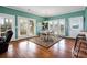 Bright dining area with hardwood floors and access to deck at 202 Mary St, Edisto Island, SC 29438