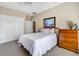 Bright bedroom with double bed, dresser, and closet at 202 Mary St, Edisto Island, SC 29438