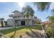 Two-story beach home with wraparound deck and lush landscaping at 202 Mary St, Edisto Island, SC 29438