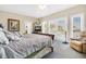 Spacious bedroom with king-size bed and access to balcony at 202 Mary St, Edisto Island, SC 29438