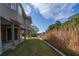 Elevated home showcasing a grassy backyard and waterfront views at 202 Mary St, Edisto Island, SC 29438