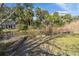 Peaceful waterfront property with a wooden dock and lush vegetation at 202 Mary St, Edisto Island, SC 29438