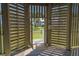 Private outdoor shower with wooden privacy screen at 202 Mary St, Edisto Island, SC 29438