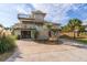 Two-story beach home with multiple decks and a spacious driveway at 202 Mary St, Edisto Island, SC 29438