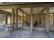 Covered patio with swings, seating and outdoor shower at 202 Mary St, Edisto Island, SC 29438