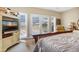 Bedroom with king-size bed and access to a balcony at 202 Mary St, Edisto Island, SC 29438