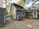 House exterior and backyard with gravel and playset at 7832 Racquet Rd, North Charleston, SC 29418