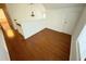 Loft bedroom with hardwood floors and a large window at 7832 Racquet Rd, North Charleston, SC 29418