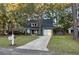 Charming house with gray siding, red door, and a long driveway at 7832 Racquet Rd, North Charleston, SC 29418