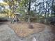 Backyard with playset and fire pit at 7832 Racquet Rd, North Charleston, SC 29418