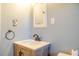 Bathroom vanity with wood cabinet and white countertop at 2736 Star Drive, North Charleston, SC 29406