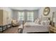 Spacious bedroom with a post bed, large windows, and plenty of room for furniture at 2215 Macallan Blvd, Ravenel, SC 29470