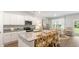 Modern kitchen with white cabinets, granite countertops, and stainless steel appliances at 2215 Macallan Blvd, Ravenel, SC 29470