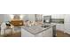 Kitchen boasts granite island, stainless steel appliances, and white cabinetry at 2215 Macallan Blvd, Ravenel, SC 29470