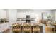 Modern kitchen with white cabinets, granite countertops, and island seating at 2215 Macallan Blvd, Ravenel, SC 29470