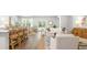Open living room showcasing hardwood floors, comfy sofas, and a stylish media cabinet at 2215 Macallan Blvd, Ravenel, SC 29470