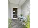 Inviting front porch with seating area and stylish doormat at 236 Godwit Dr, Summerville, SC 29486