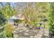 Landscaped backyard with a stone patio and bird bath at 211 Ilderton St, Summerville, SC 29483