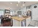 Open kitchen with island, granite counters, stainless steel appliances, and breakfast bar at 211 Ilderton St, Summerville, SC 29483