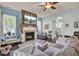 Bright living room features a fireplace, hardwood floors and a large sectional sofa at 211 Ilderton St, Summerville, SC 29483