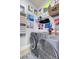 Laundry room with washer, dryer, and plenty of shelving for storage at 211 Ilderton St, Summerville, SC 29483