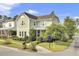Two-story house with light green siding, a metal roof and manicured lawn at 211 Ilderton St, Summerville, SC 29483