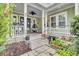 Inviting front porch with wicker chairs and a stone patio at 211 Ilderton St, Summerville, SC 29483