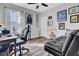 Home office with hardwood floors, desk, and comfy couch at 211 Ilderton St, Summerville, SC 29483
