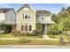 Charming two-story home with a light green exterior and landscaped yard at 211 Ilderton St, Summerville, SC 29483