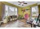 Bright playroom with built-in shelving and hardwood floors at 211 Ilderton St, Summerville, SC 29483